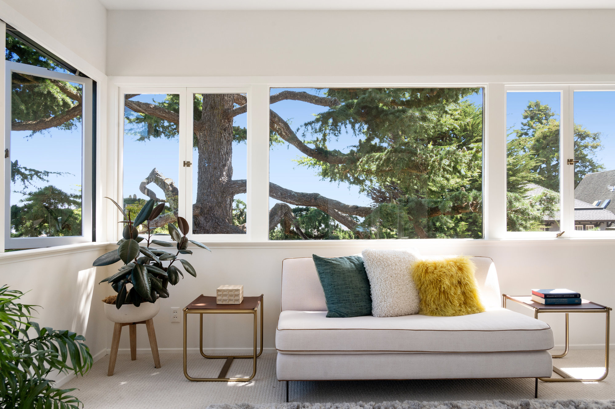112pu019 Tree-filled view of the sitting area with casement windows open