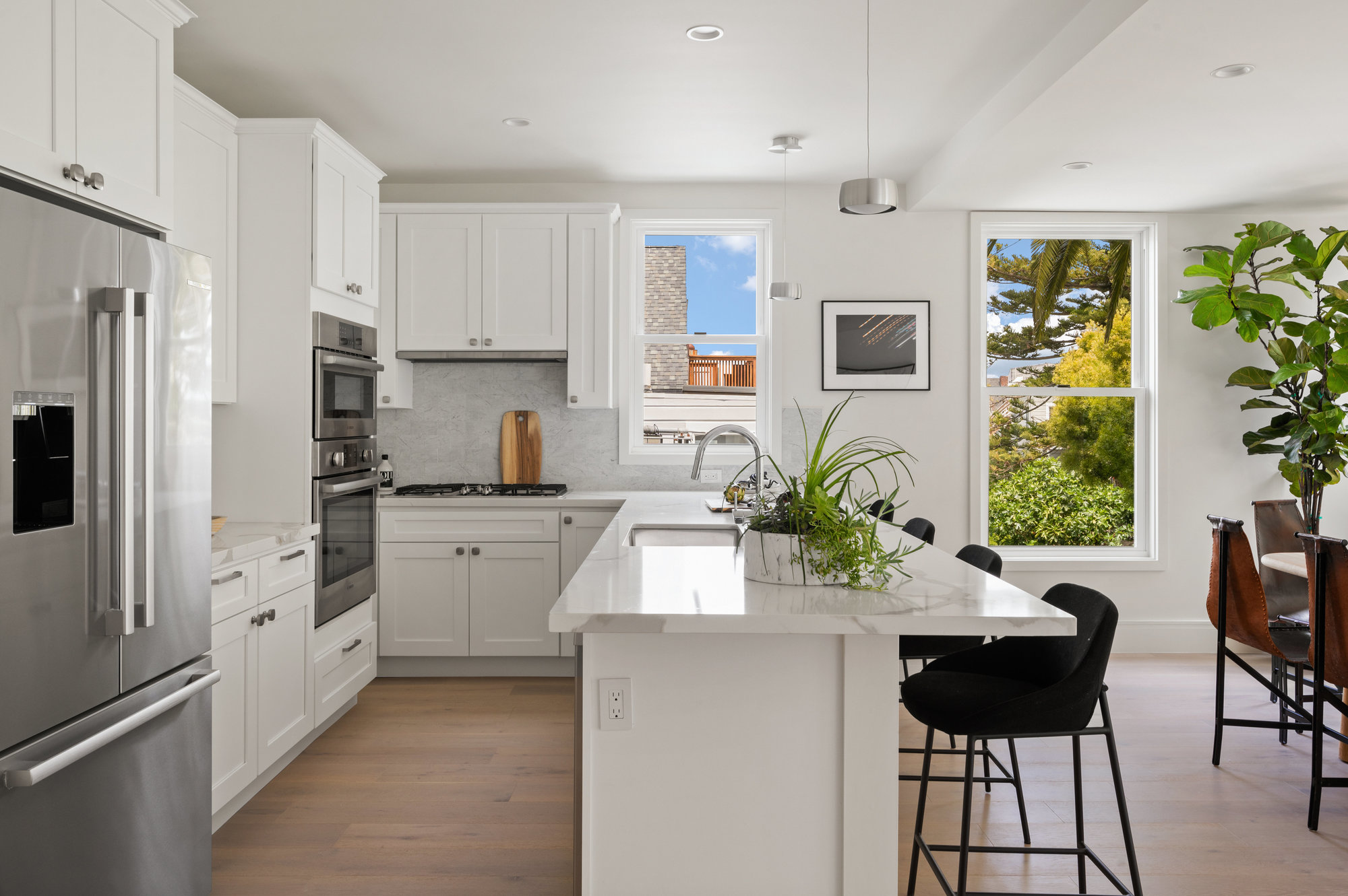 Kitchen has light stone counter tops.