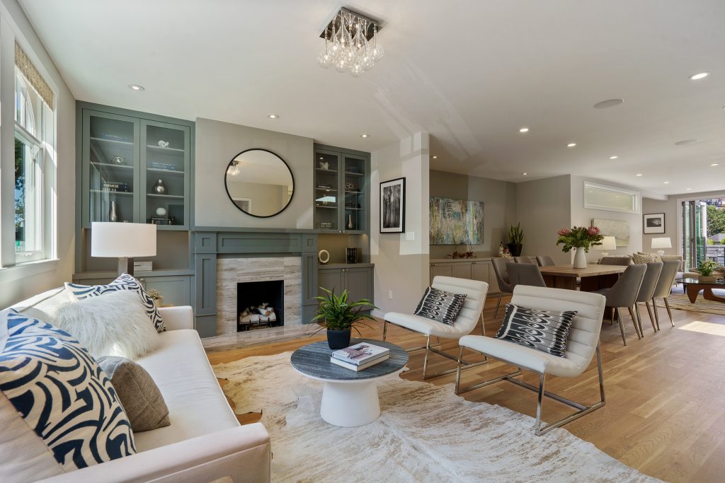 Living room with a fireplace and wood floors