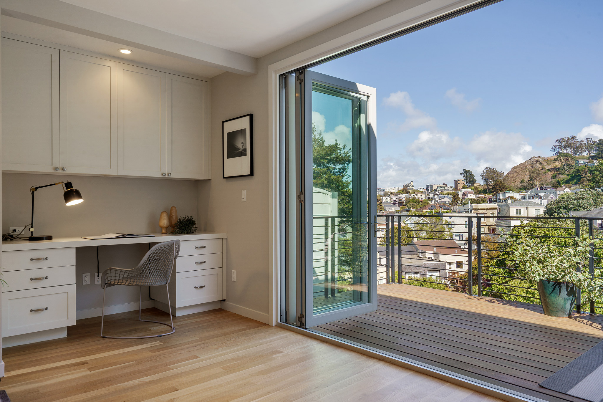 118-woodland-avenue.46233.p4k.021.web Open French doors show a view of Cole Valley