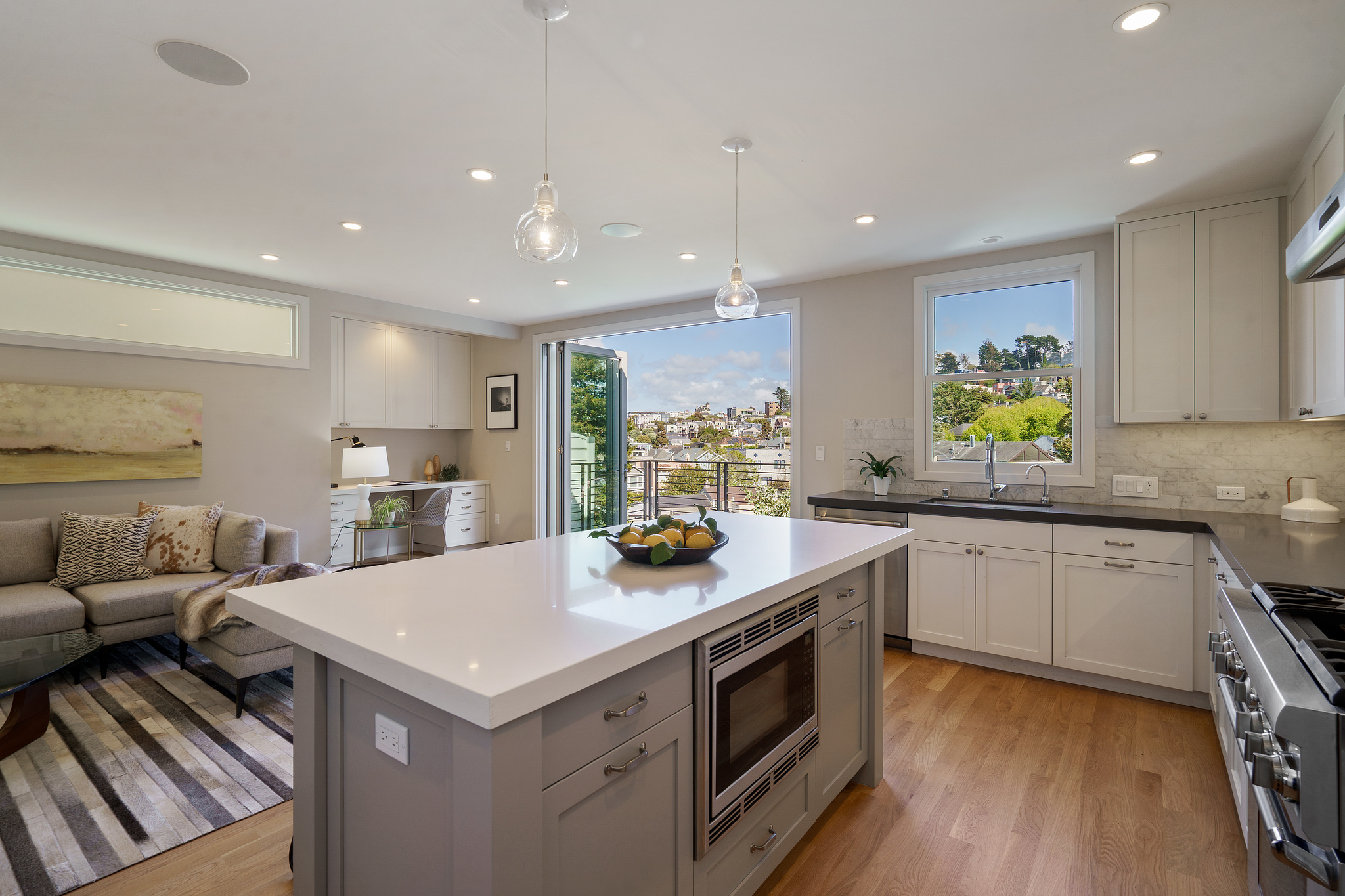 118-woodland-avenue.46233.p4k.044.web Kitchen island with oven and a view through open glass doors