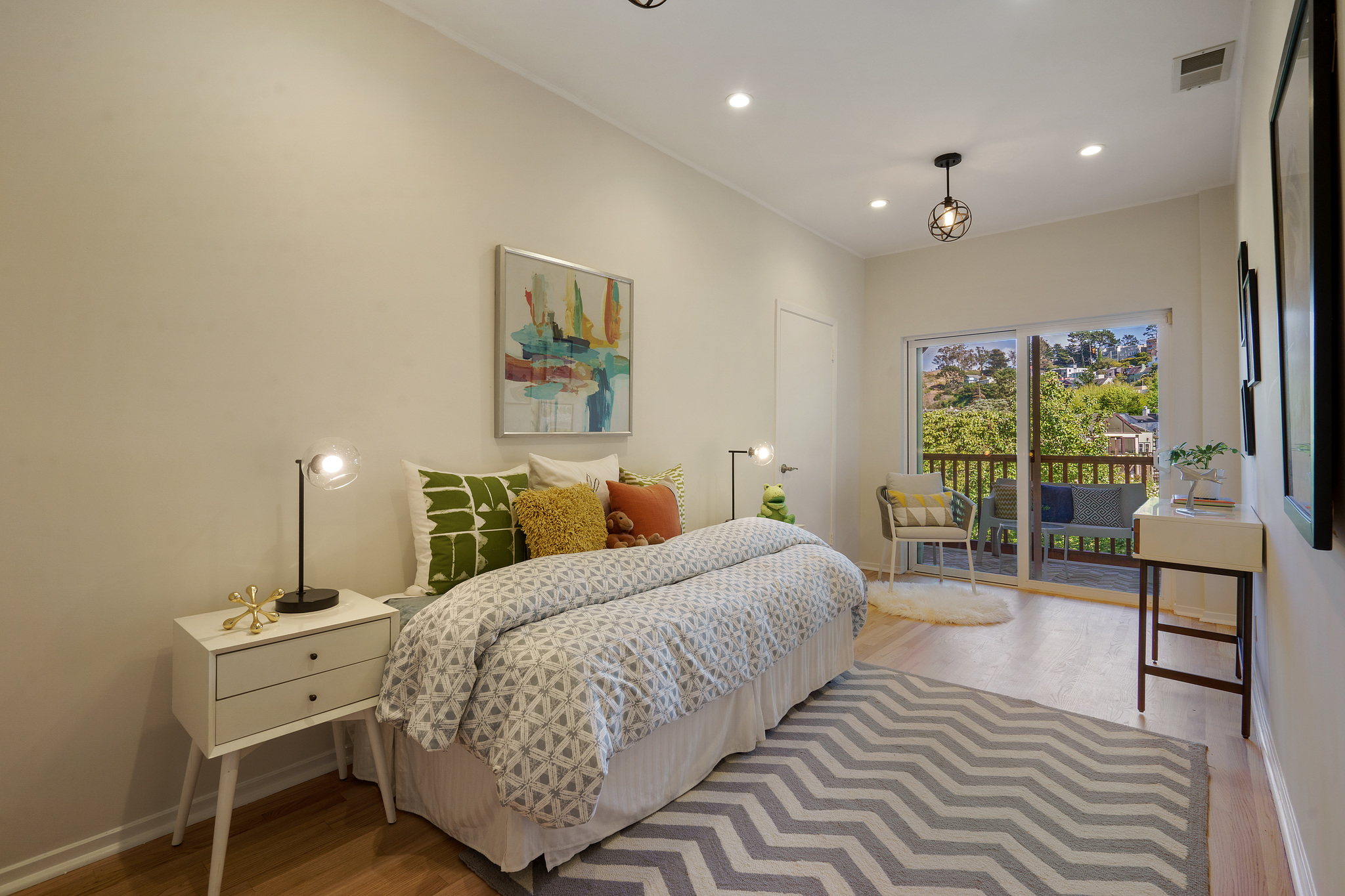 118-woodland-avenue.46233.p4k.063.web A smaller bedroom with a daybed, wood floors and glass patio doors
