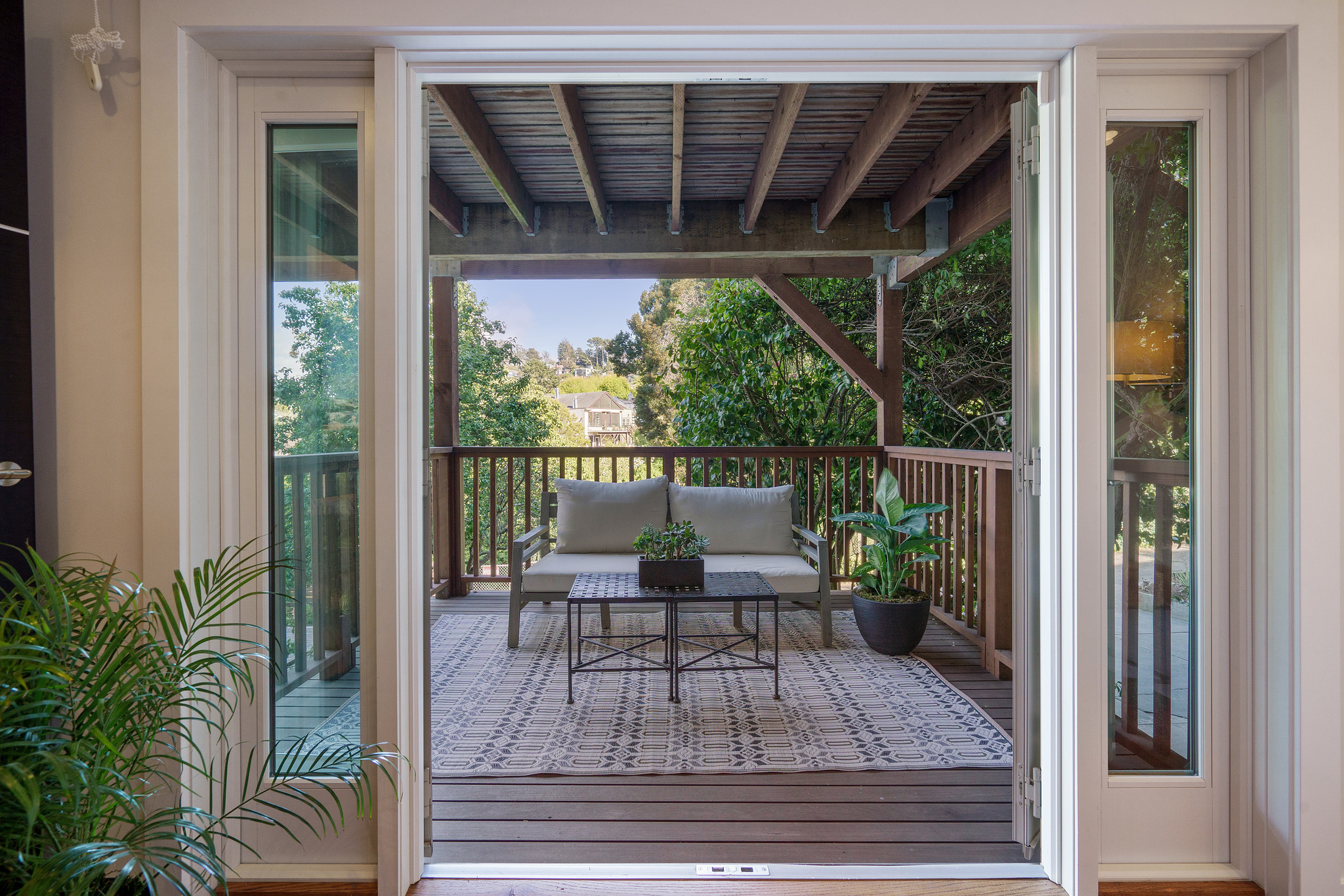 118-woodland-avenue.46233.p4k.075.web An outdoor couch as seen through open glass doors
