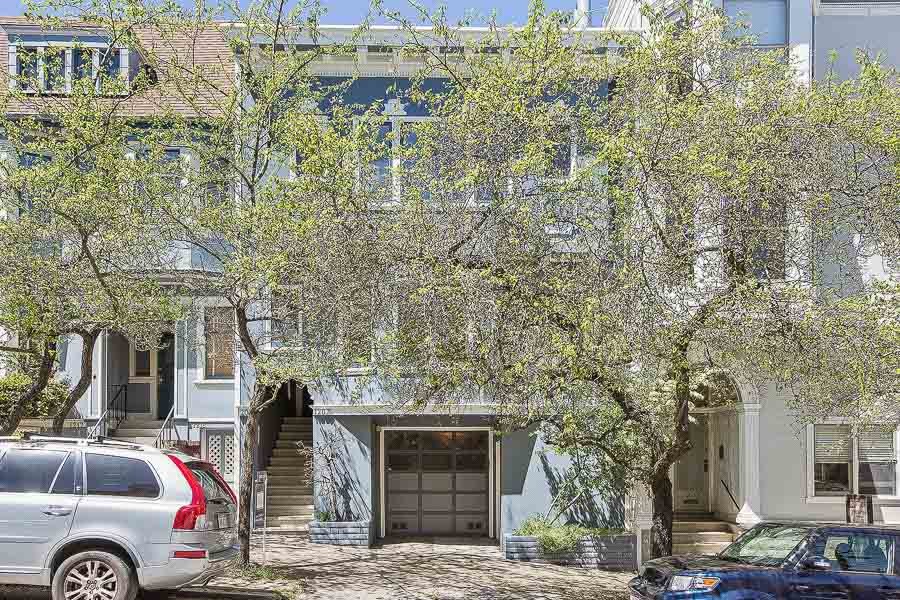 Front exterior view of 1209 Cole Street, featuring a blue facade