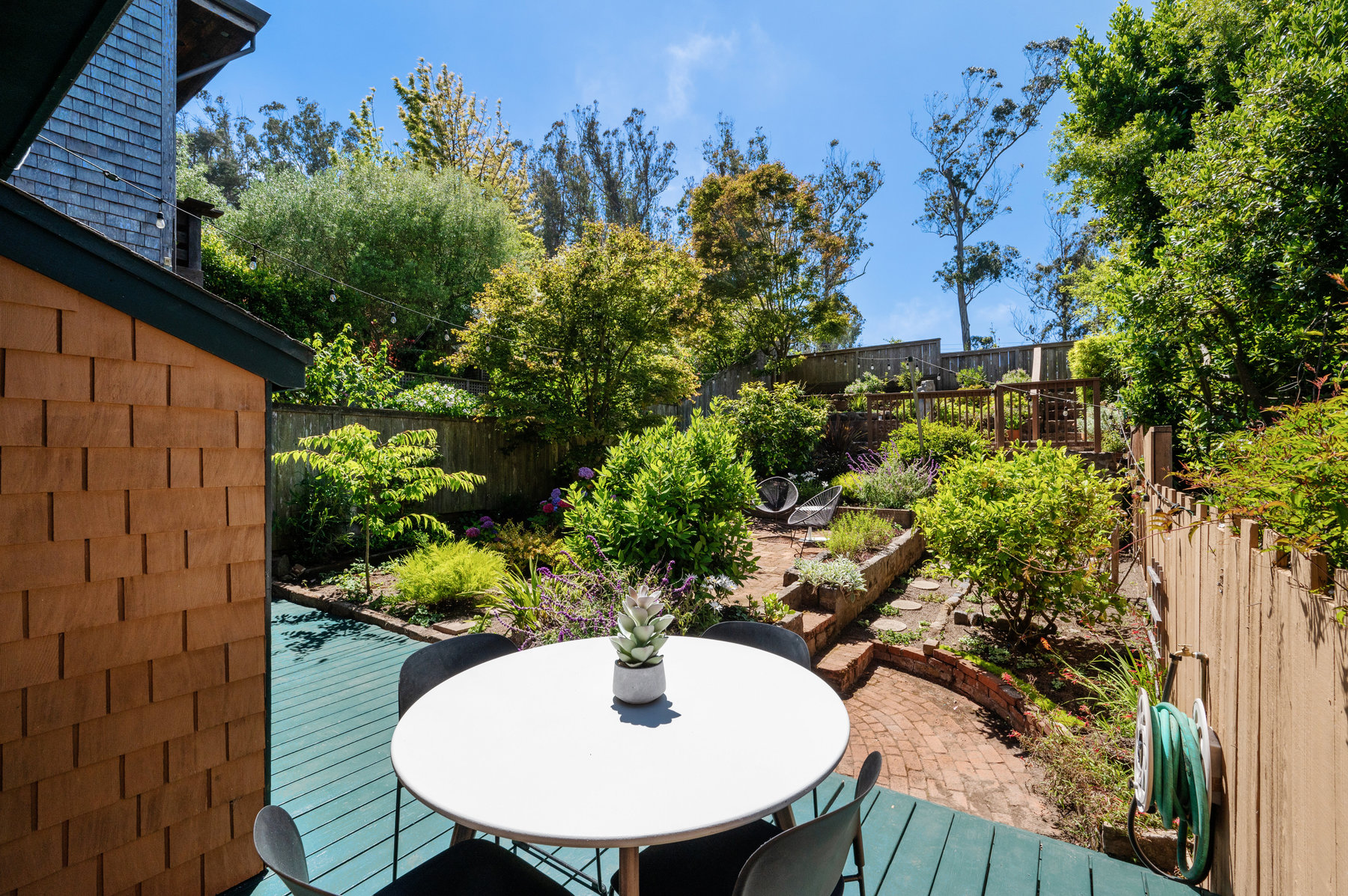 Looking off of deck to back yard.  There is an area for small round table on deck,