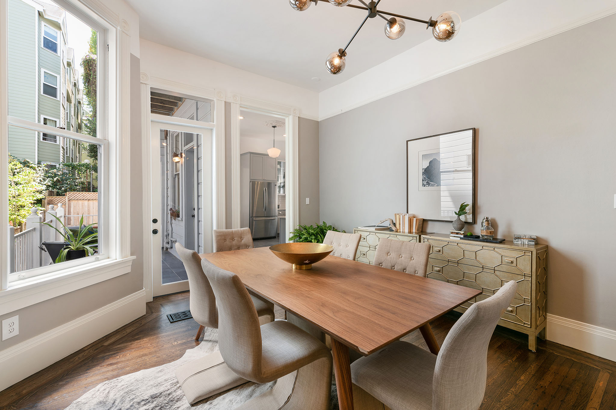13 View of the dining room, featuring crown moulding and lots of natural light