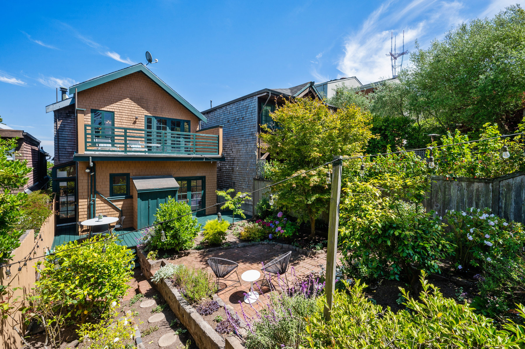 Look at lush side of yard and there is a walkway that leads back to deck.