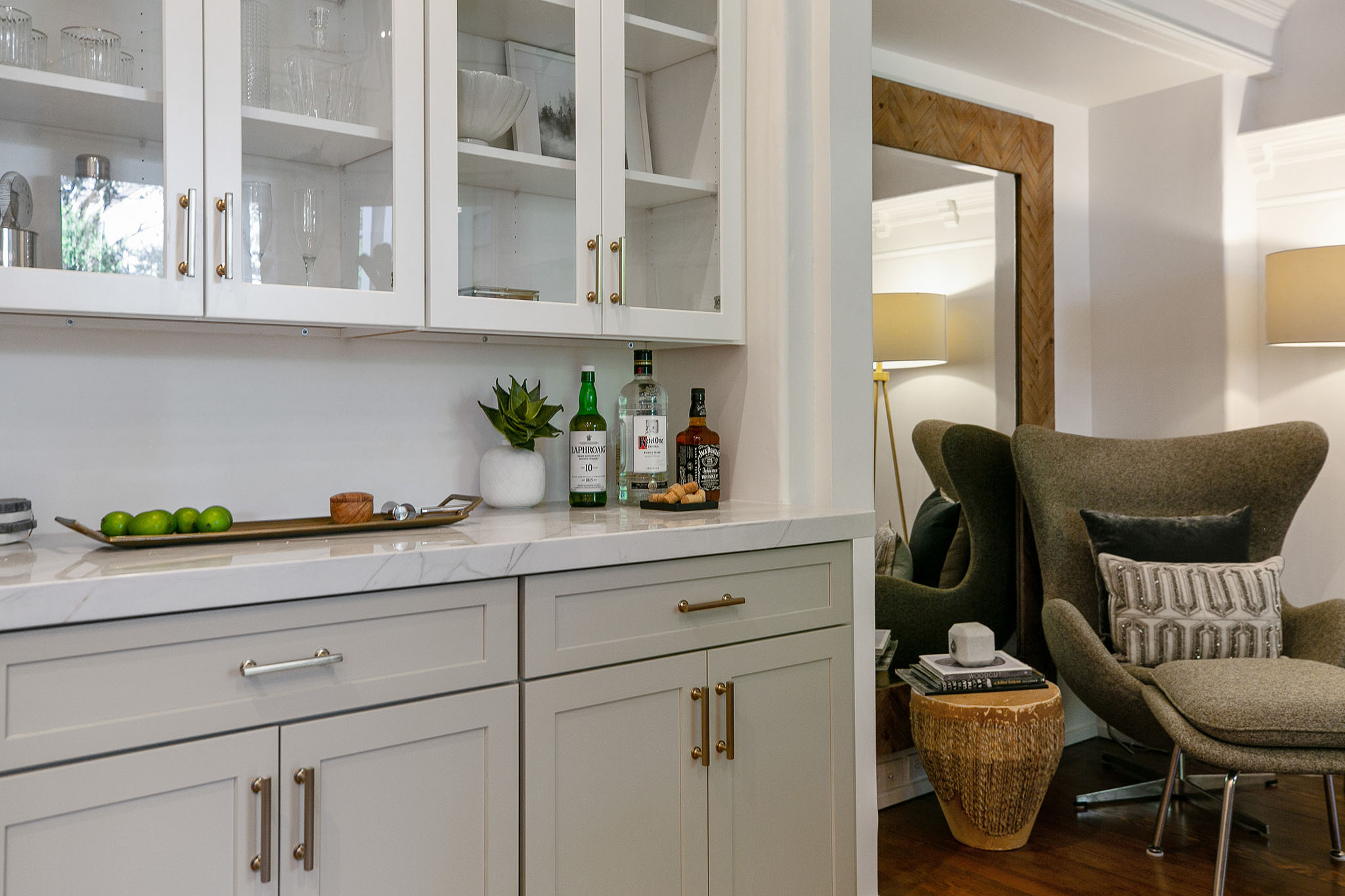 15 Close-up of cabinetry with upper glass doors and a white counter-top