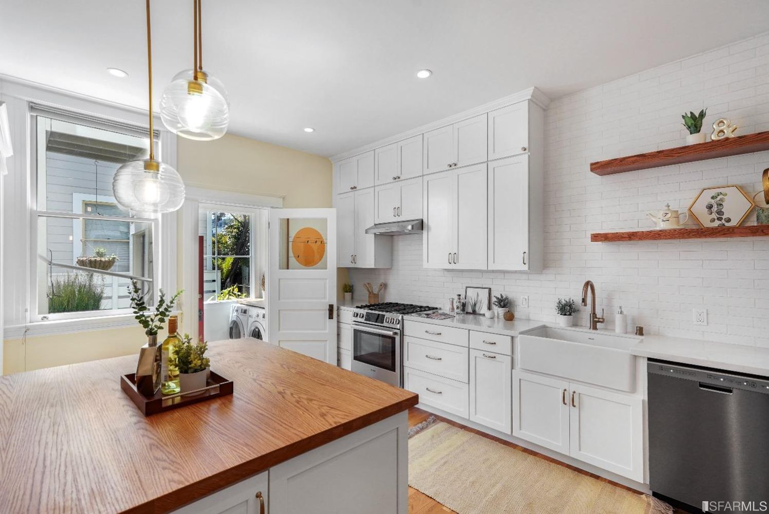 View of the kitchen, featuring wood floors