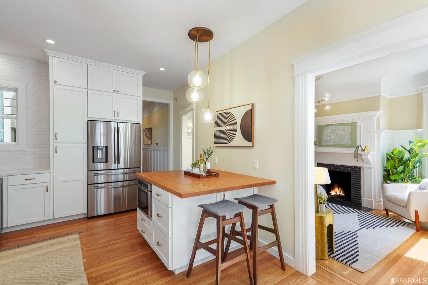 View of the kitchen and eat-in dining area with island