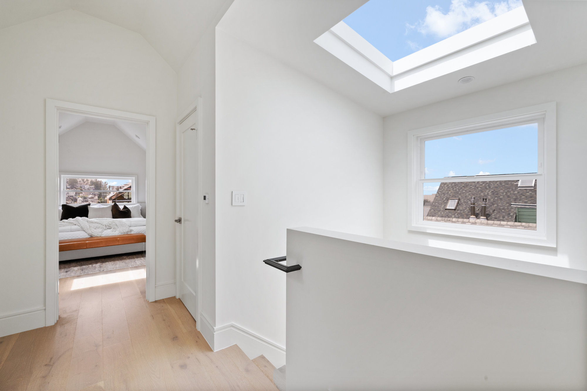 Looking into primary bedroom from landing.