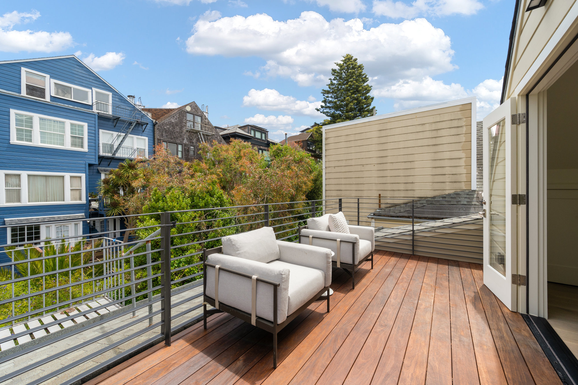 Deck on upper level.  There are two sitting chairs.