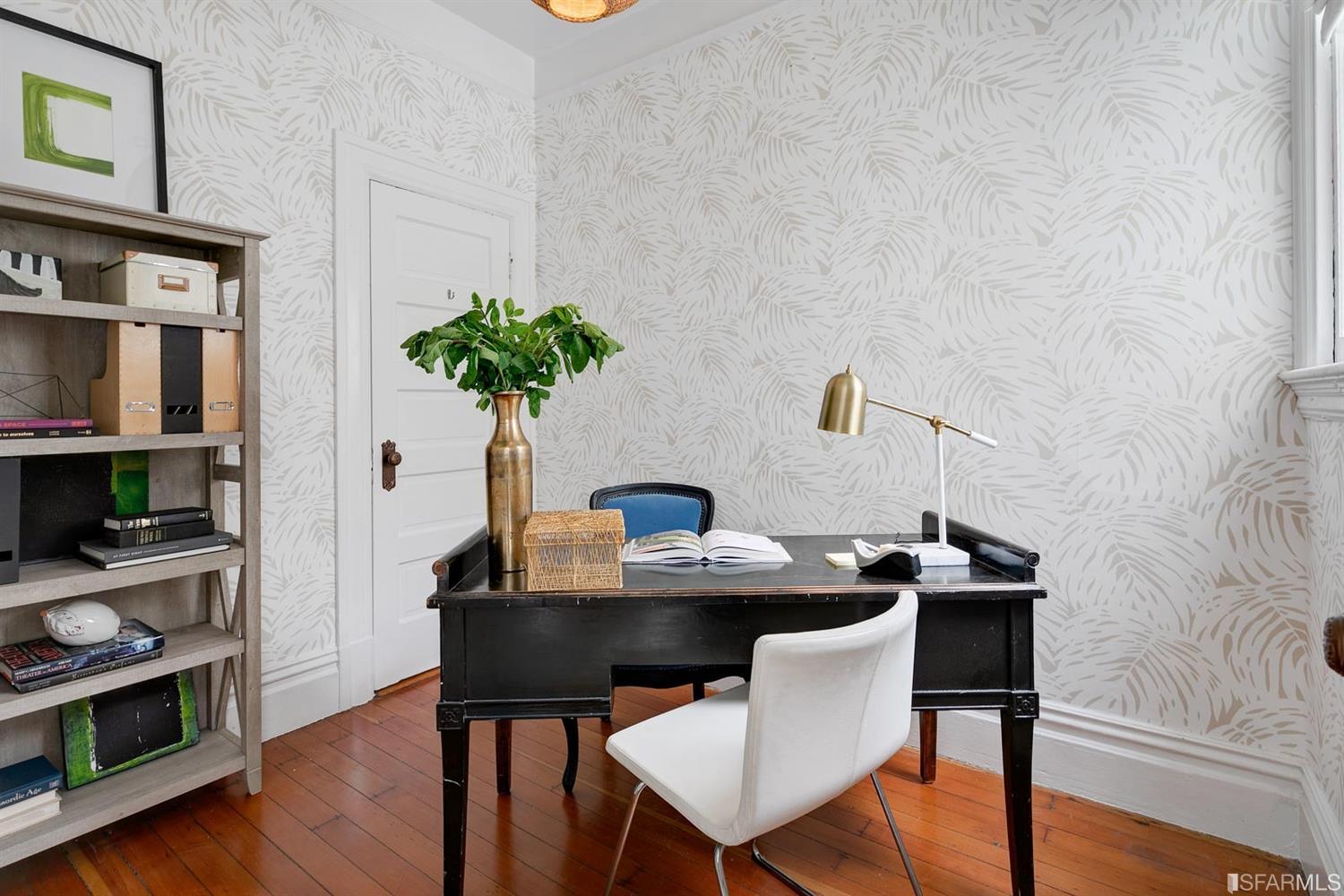 View of an office, featuring wood floors and natural light