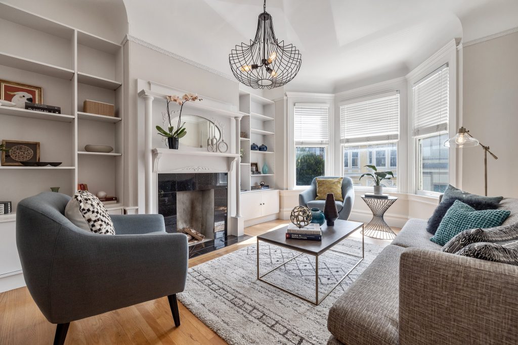 Living room with built-in cabinets and fireplace