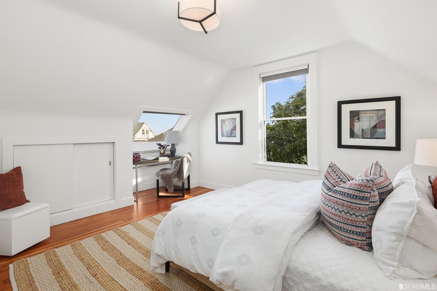 View of a bedroom with wood floors