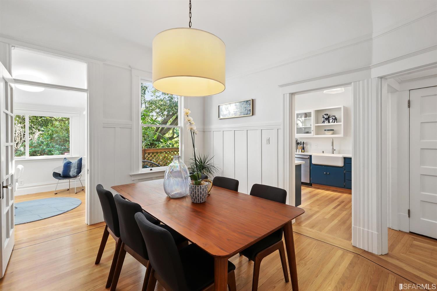 Formal dining room with wood floors