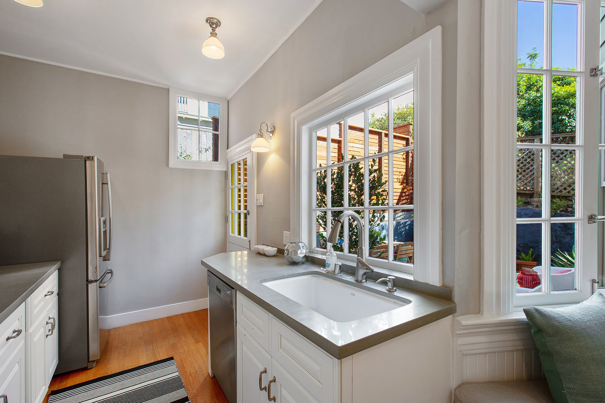 Kitchen, featuring large windows and sink area