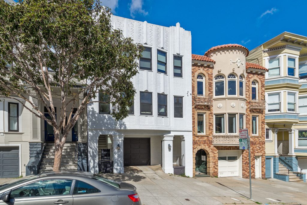 Front exterior of 228 Liberty Street, featuring a white facade