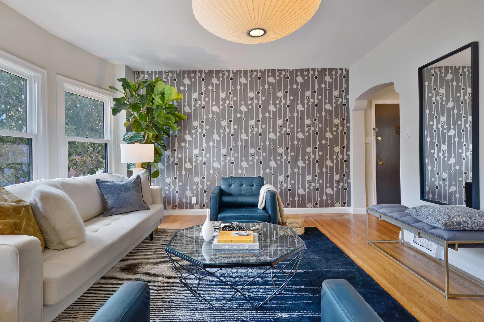 Side-view of the living room, showing one wall with art deco wall paper