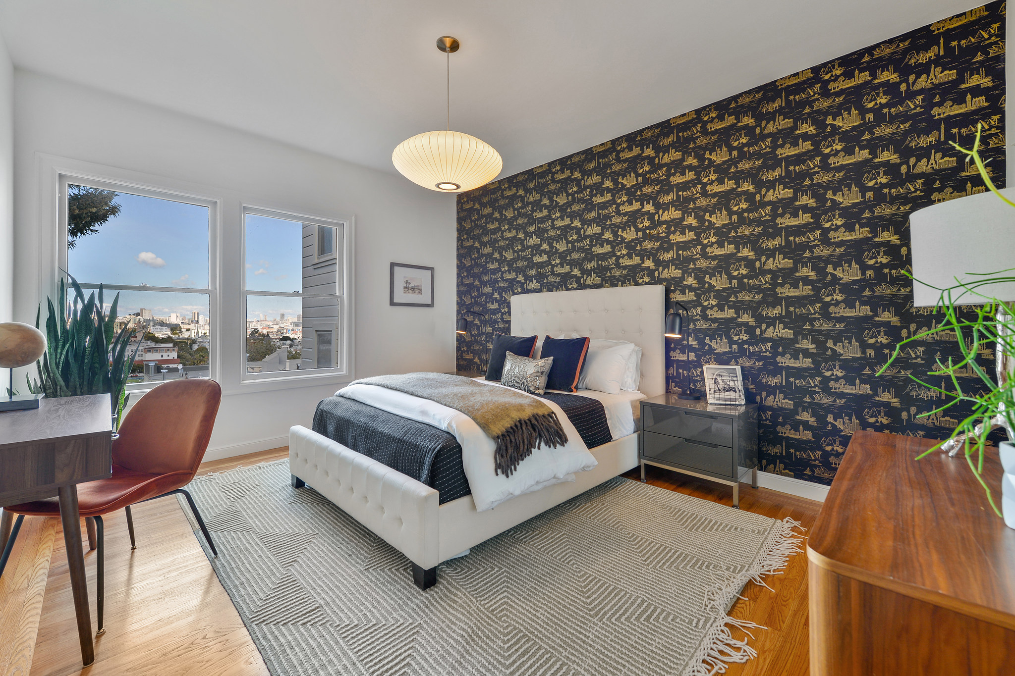Large bedroom with wood floors and views of Delores park