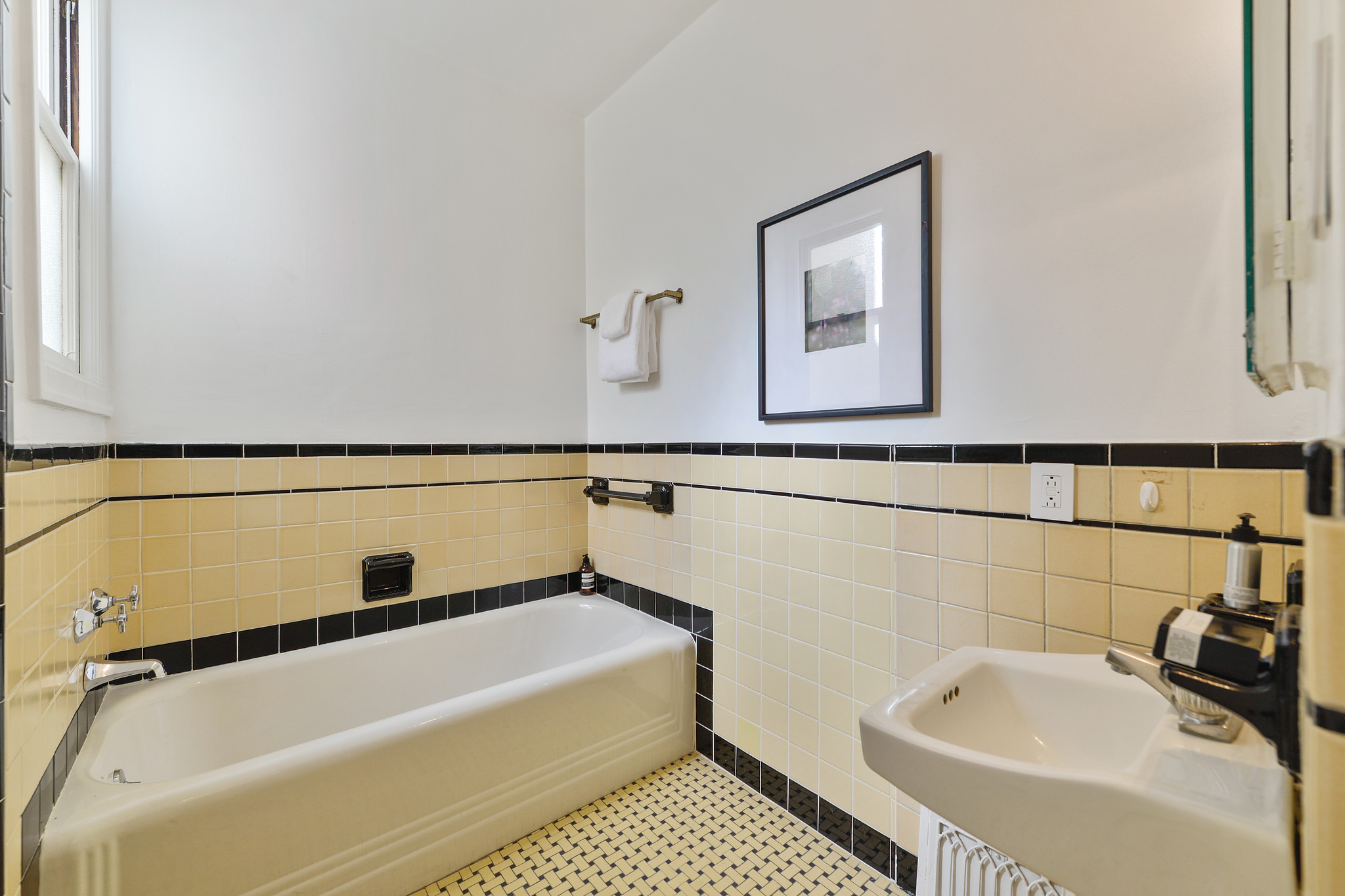 Art deco style bathroom with pale yellow tile