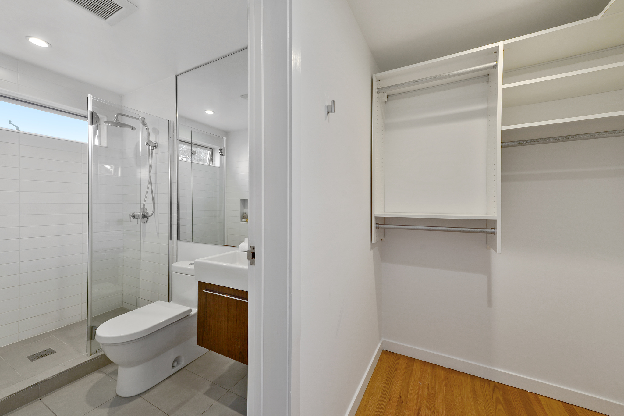 Partial view of a bathroom and closet