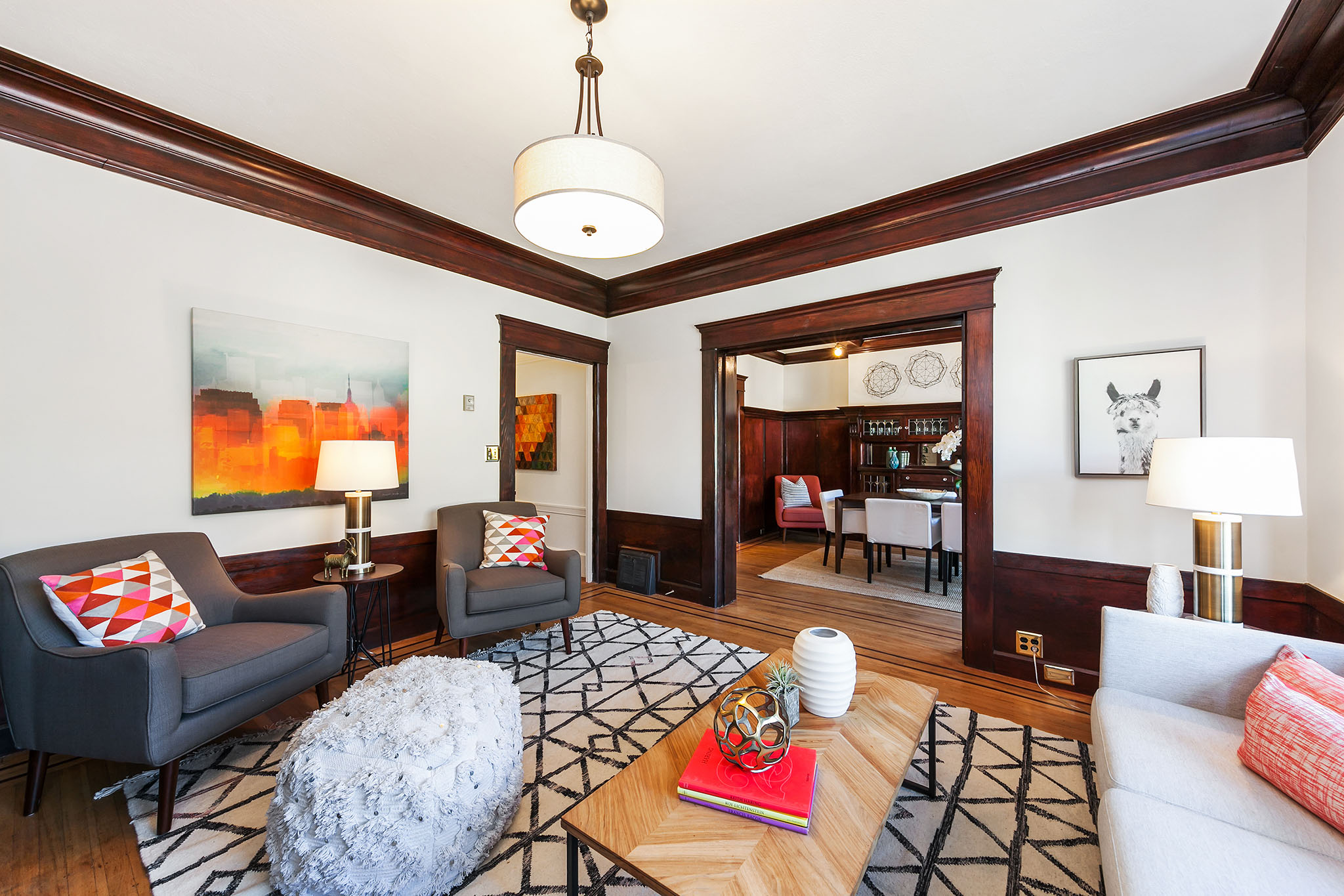 View of the living room, featuring wood floors