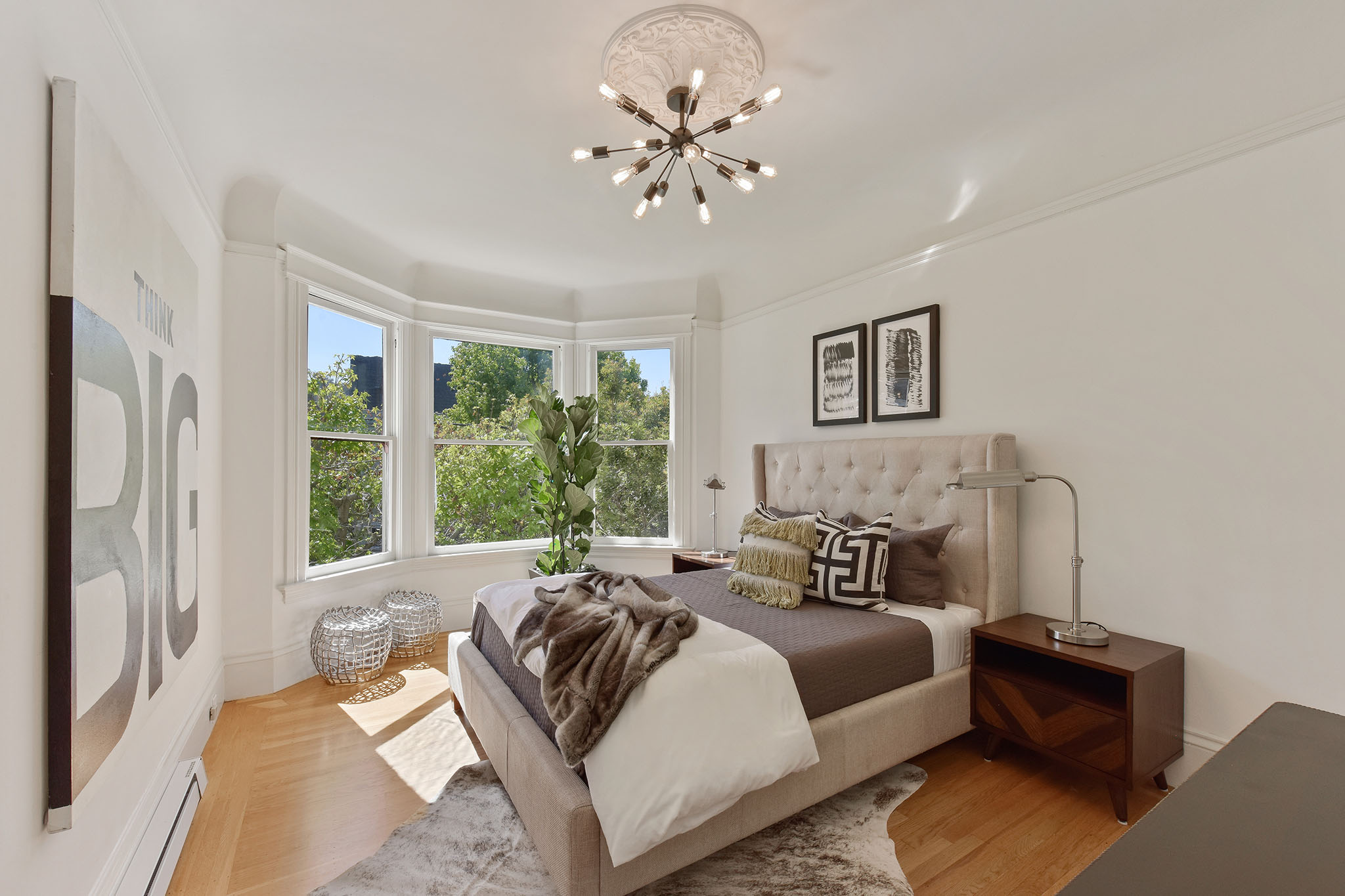 Bedroom, featuring wood floors and bay windows