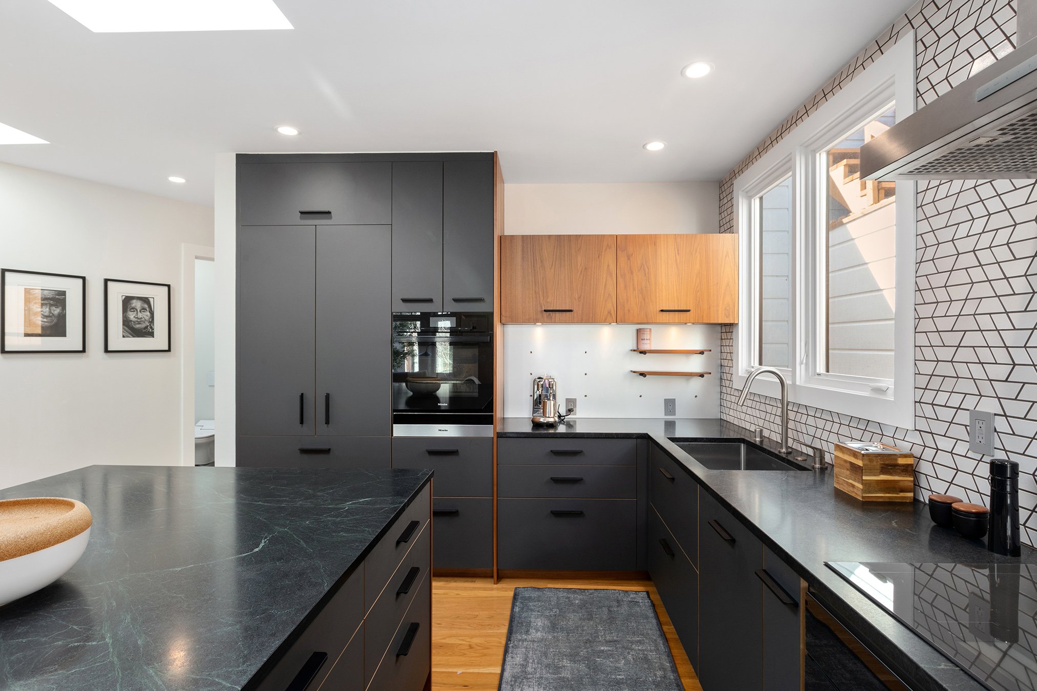 Chef's kitchen with Miele ovens and wood floors