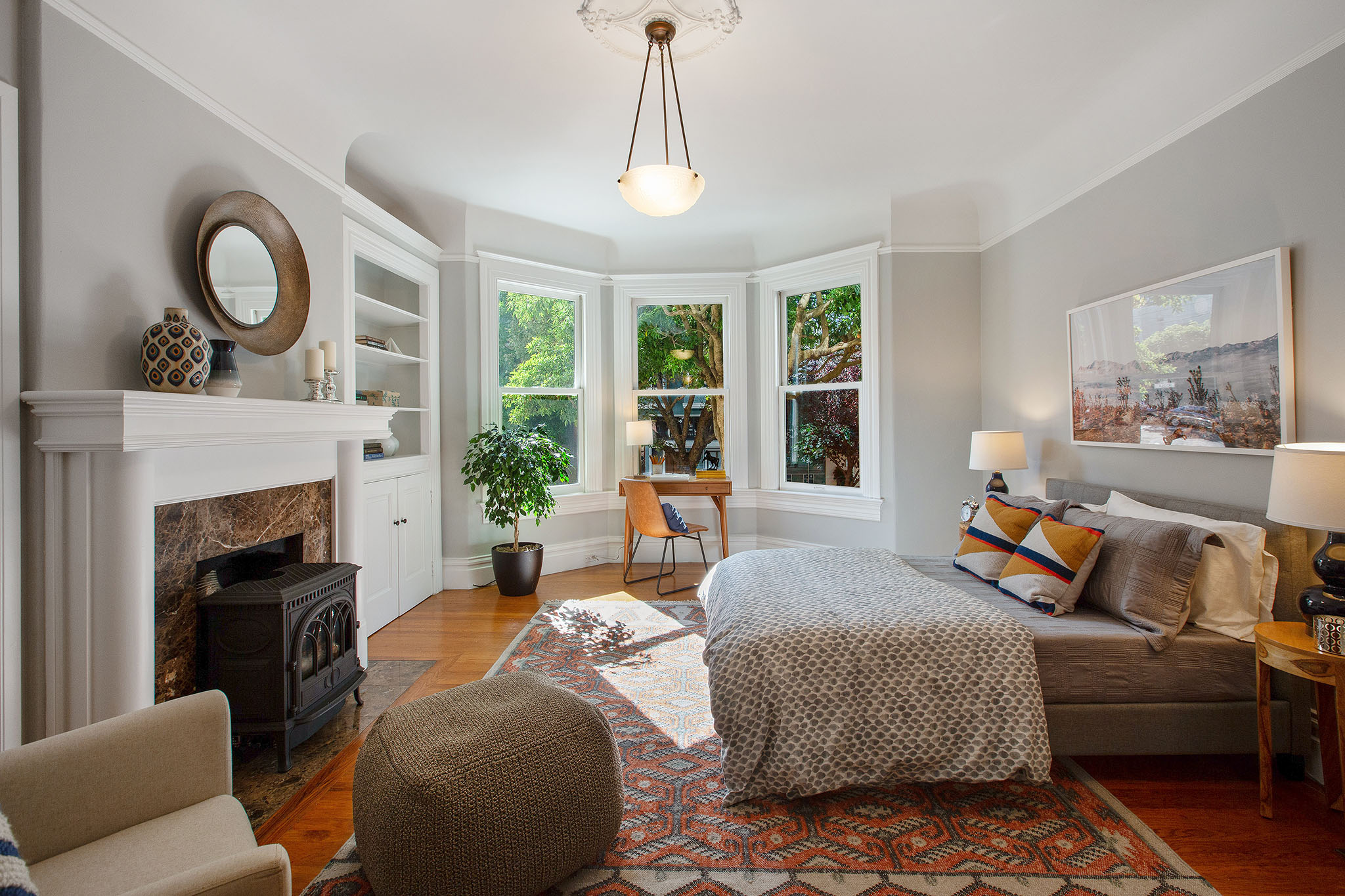 View of the bedroom, showcasing the natural light from the bay window