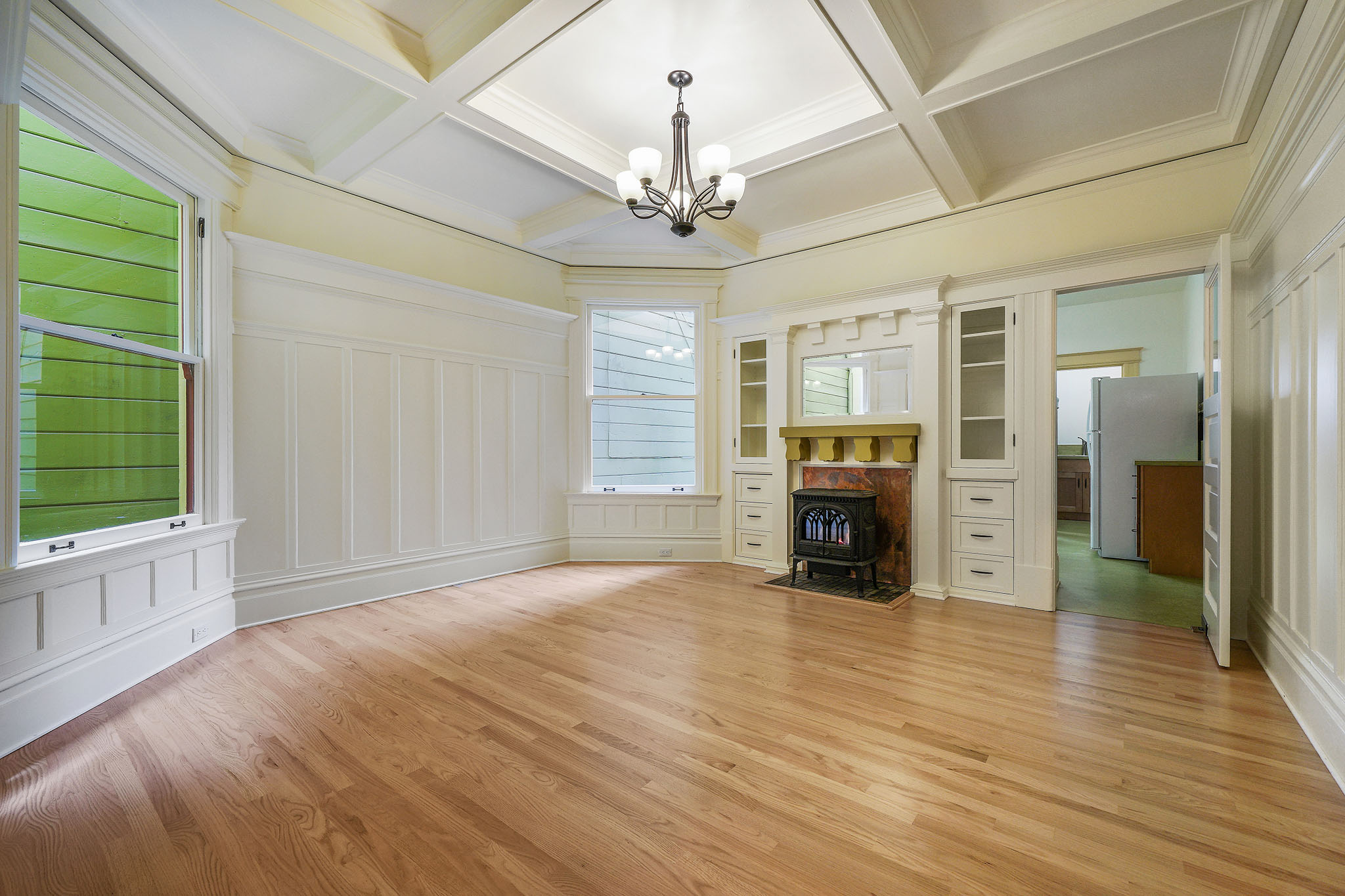 Living room, with a view of a fireplace and built-in cabinets