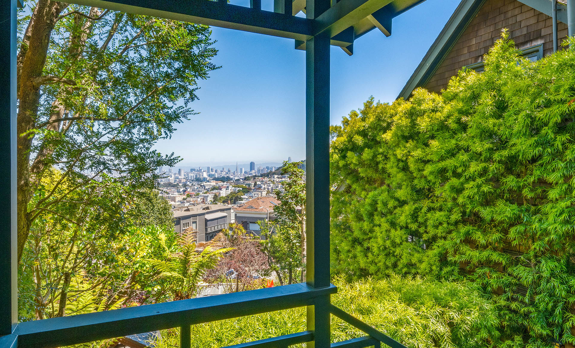 Looking towards downtown from the top of front steps. Lots of lush greenery