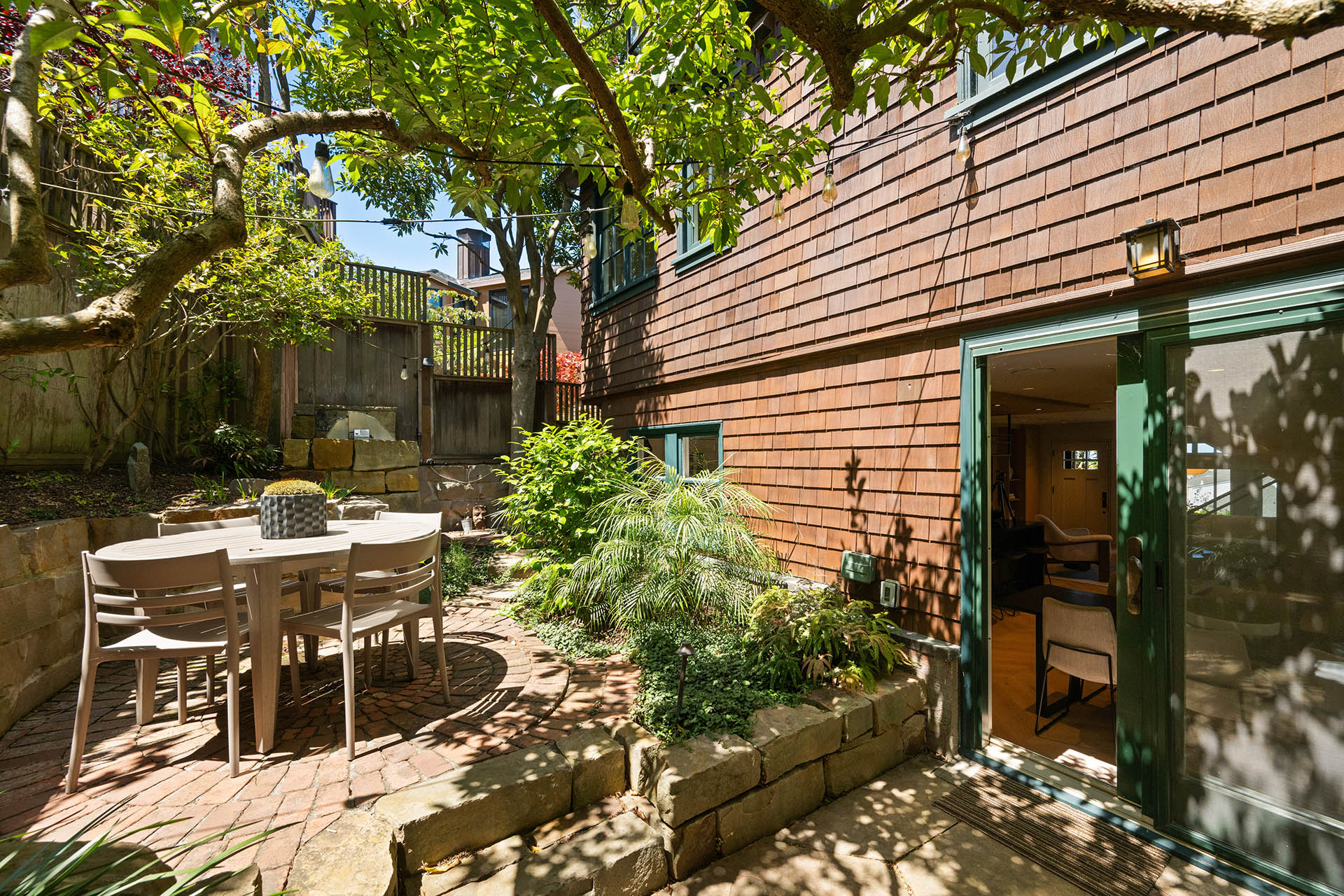 There is a small round table in the back yard.
