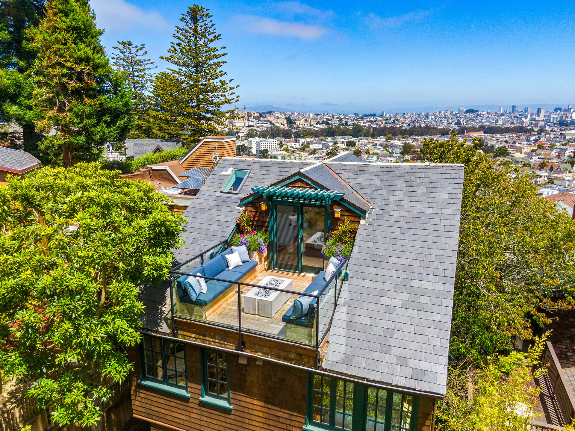 Aerial photo looking over the back deck, and over the top of the house looking at downtown san francisco.