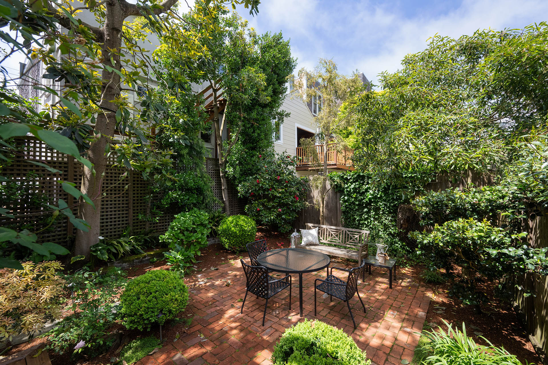 Another photo of the yard highlighting all the lush greenery