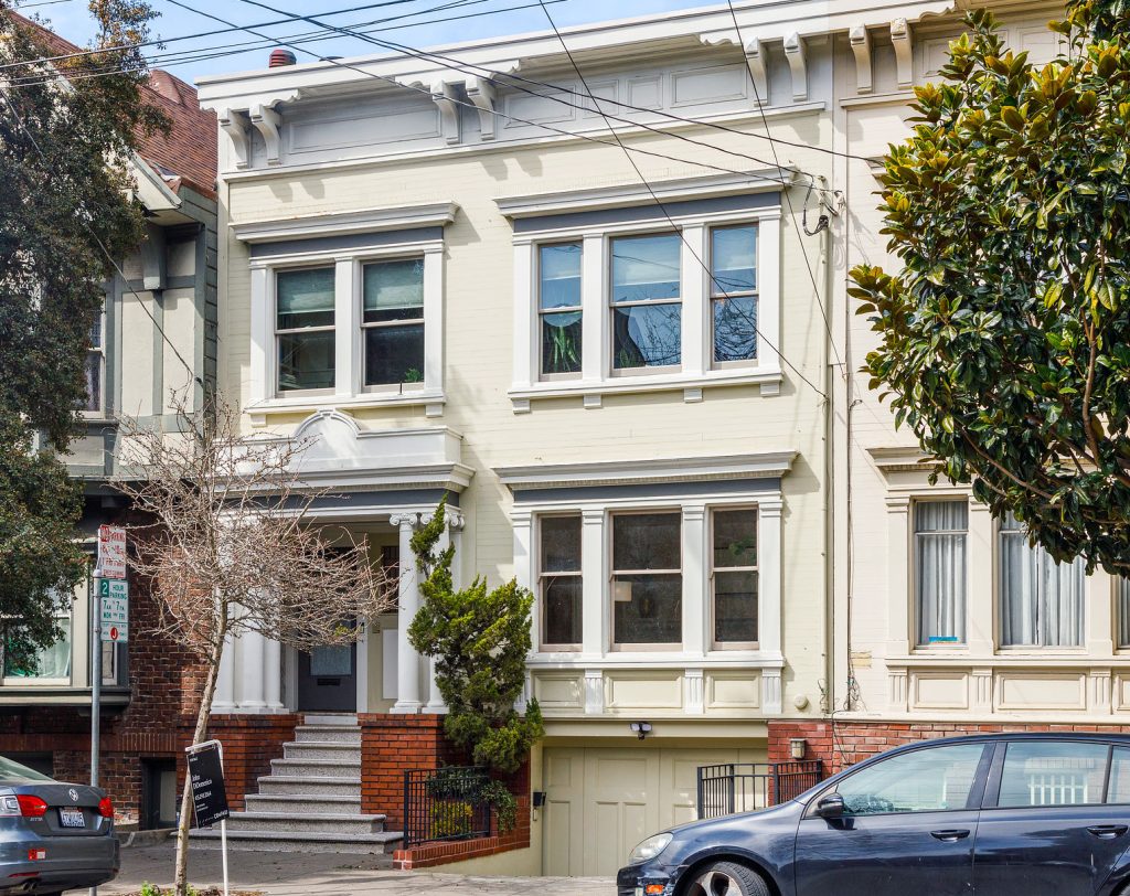 Front exterior of 36 Parnassus Avenue, showing a pale cream-colored home