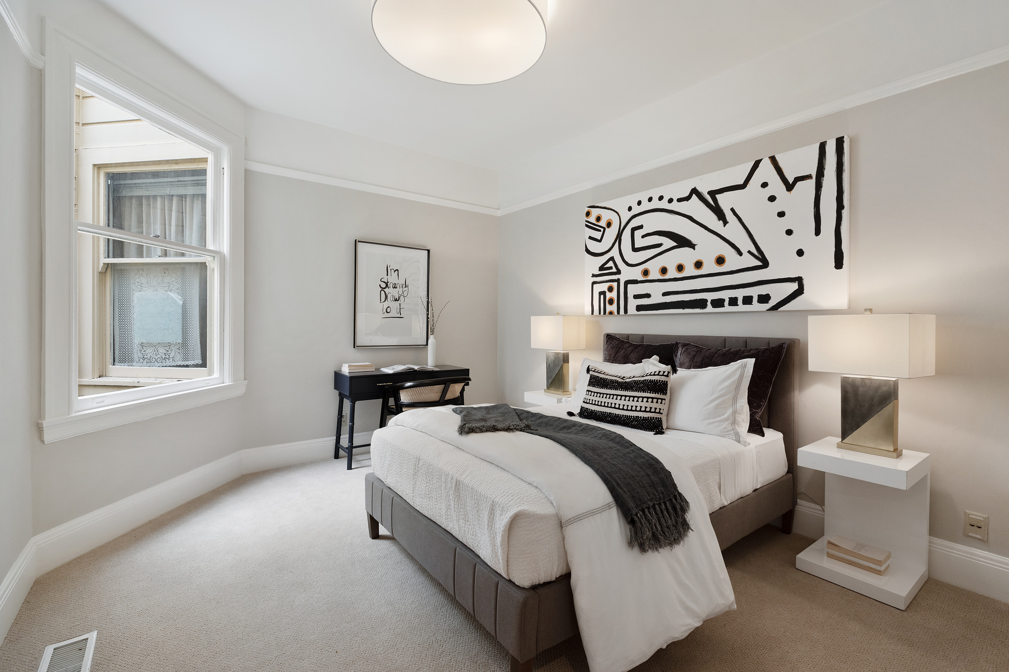 Bedroom with carpet and large window