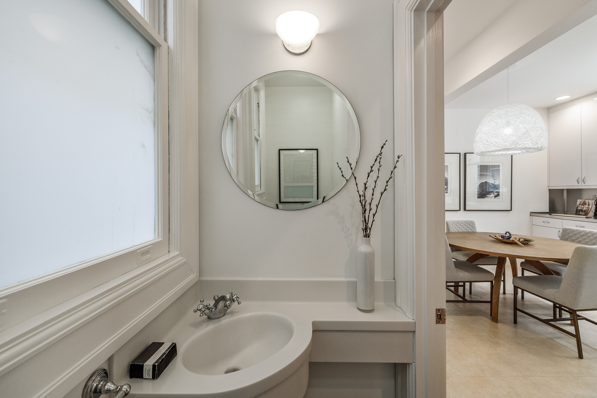 Bathroom with partial view into the dining area