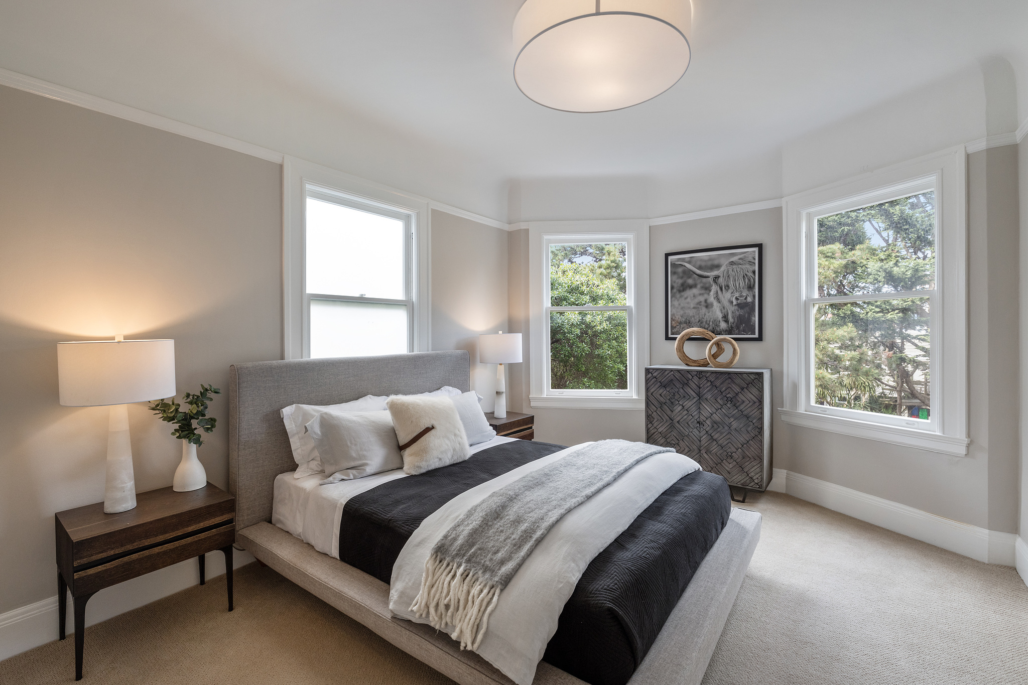 Large bedroom with three large windows