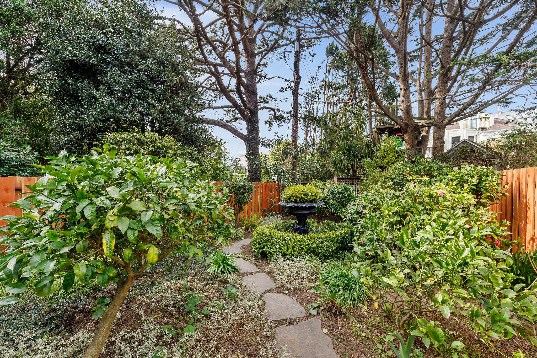 Stone path leading to the back garden