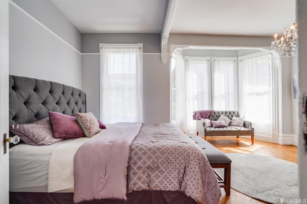 421594575221 Primary bedroom with a bay window setting area