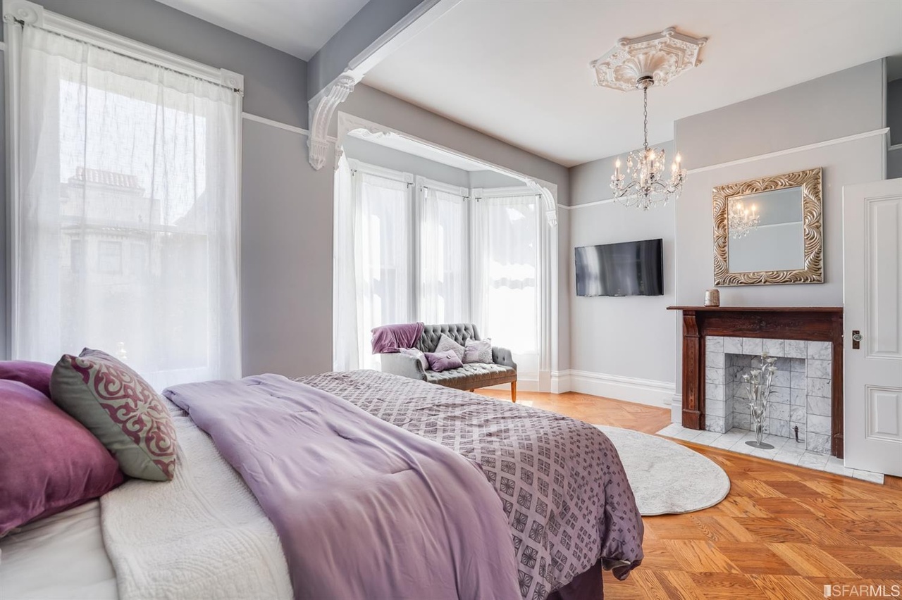 421594575251 View of primary bedroom with fireplace