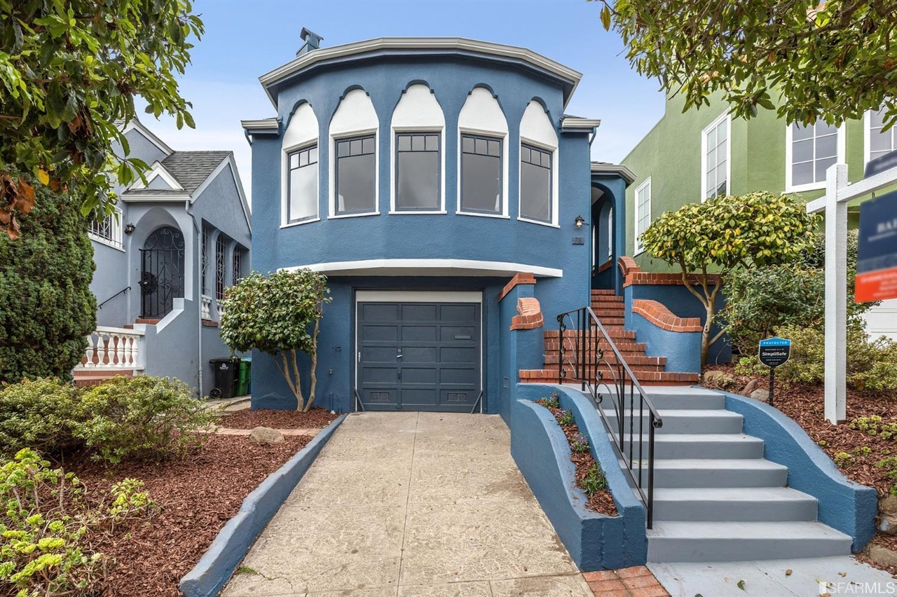 Exterior view of 78 Wawona featuring a blue façade 