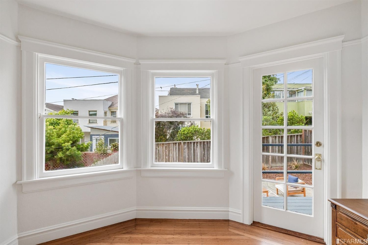 421601381520 Two windows and a door provide a partial view of the yard at 78 Wawona Street