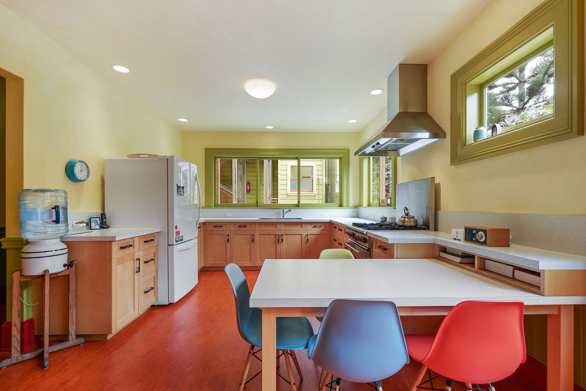 Kitchen, featuring large windows and wood cabinets