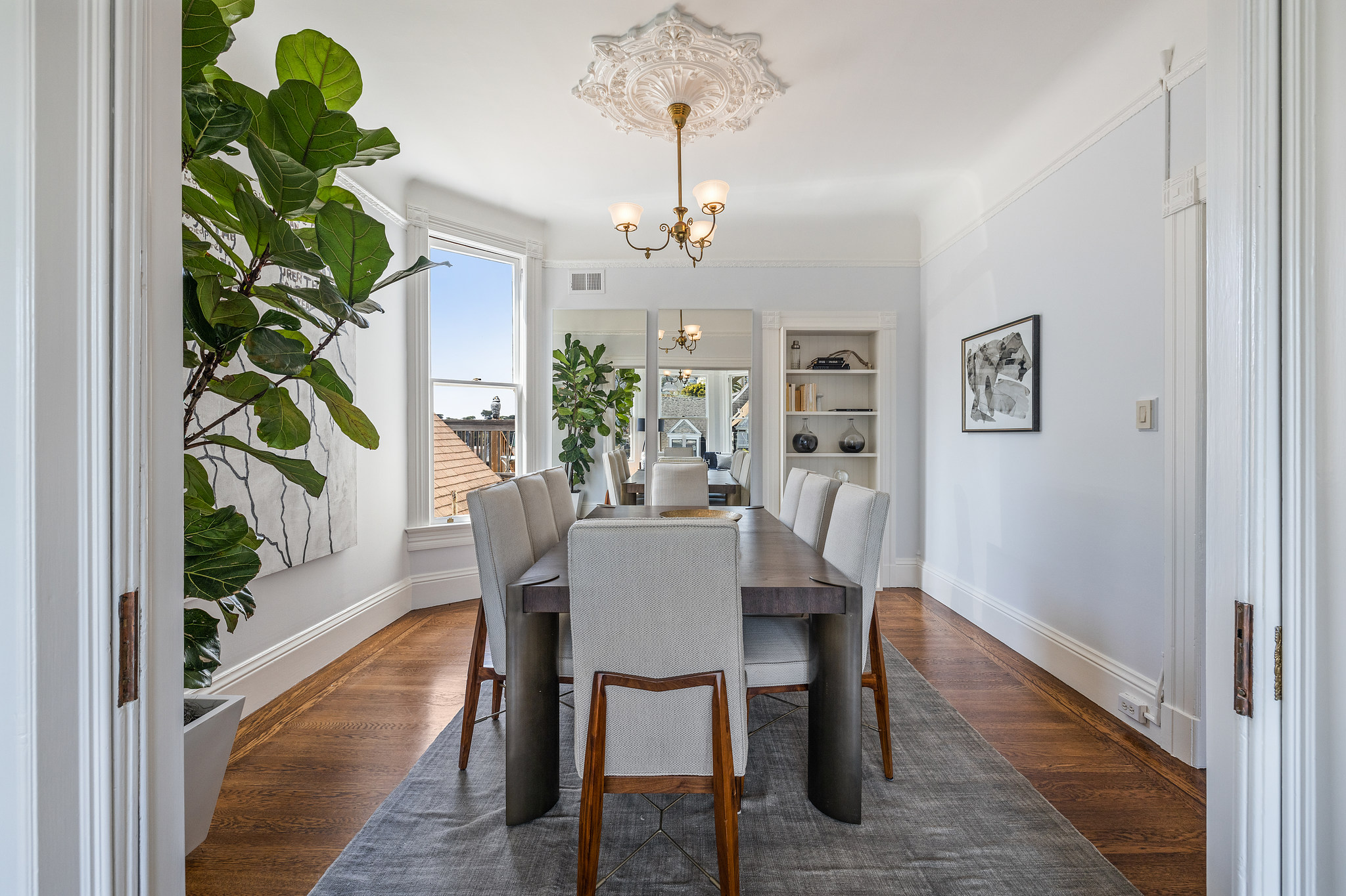 Formal dining room, with wood floors and period moulding