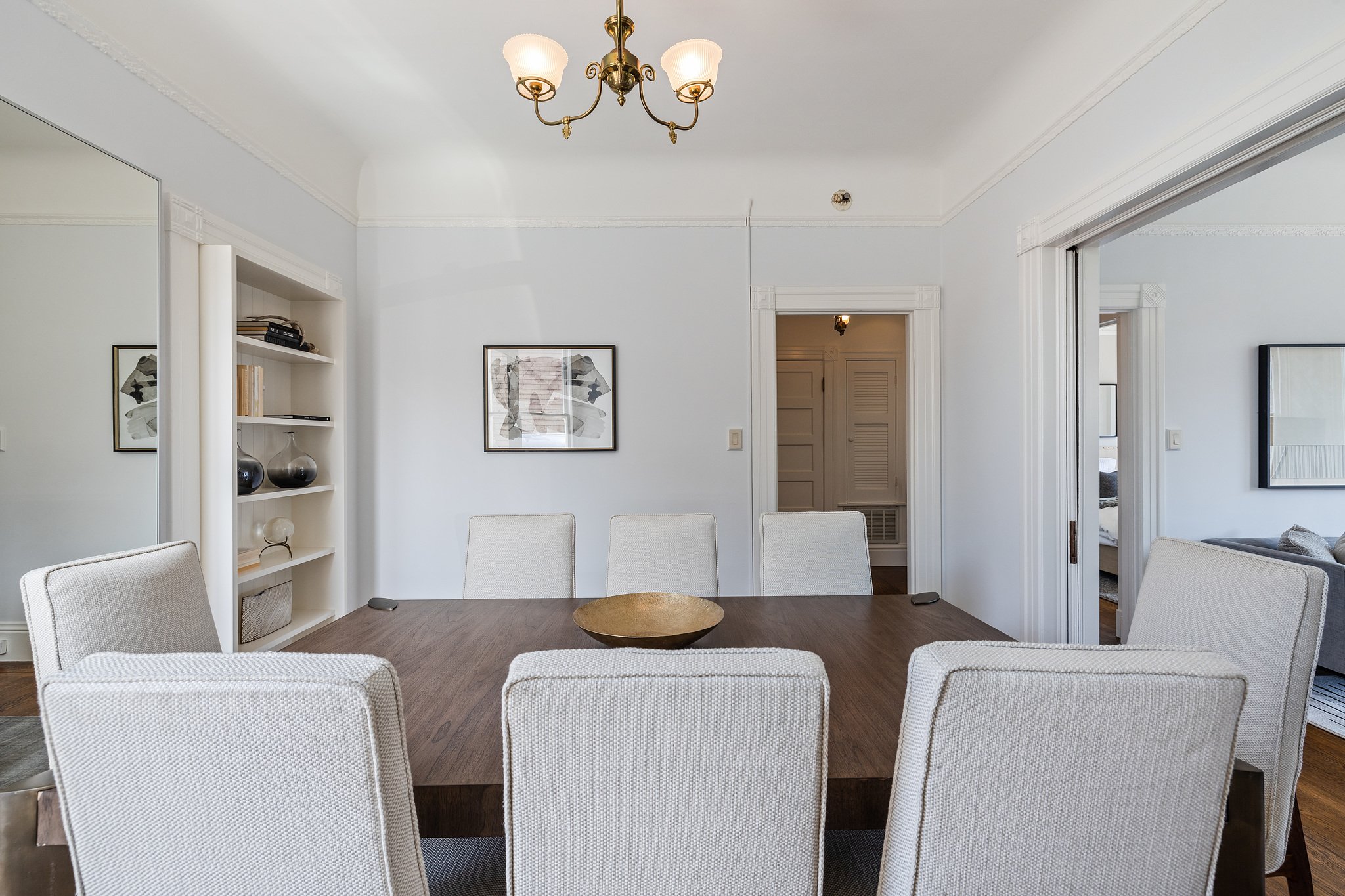 Close-up of the dinning room, showing build-in cabinets and vintage light fixture