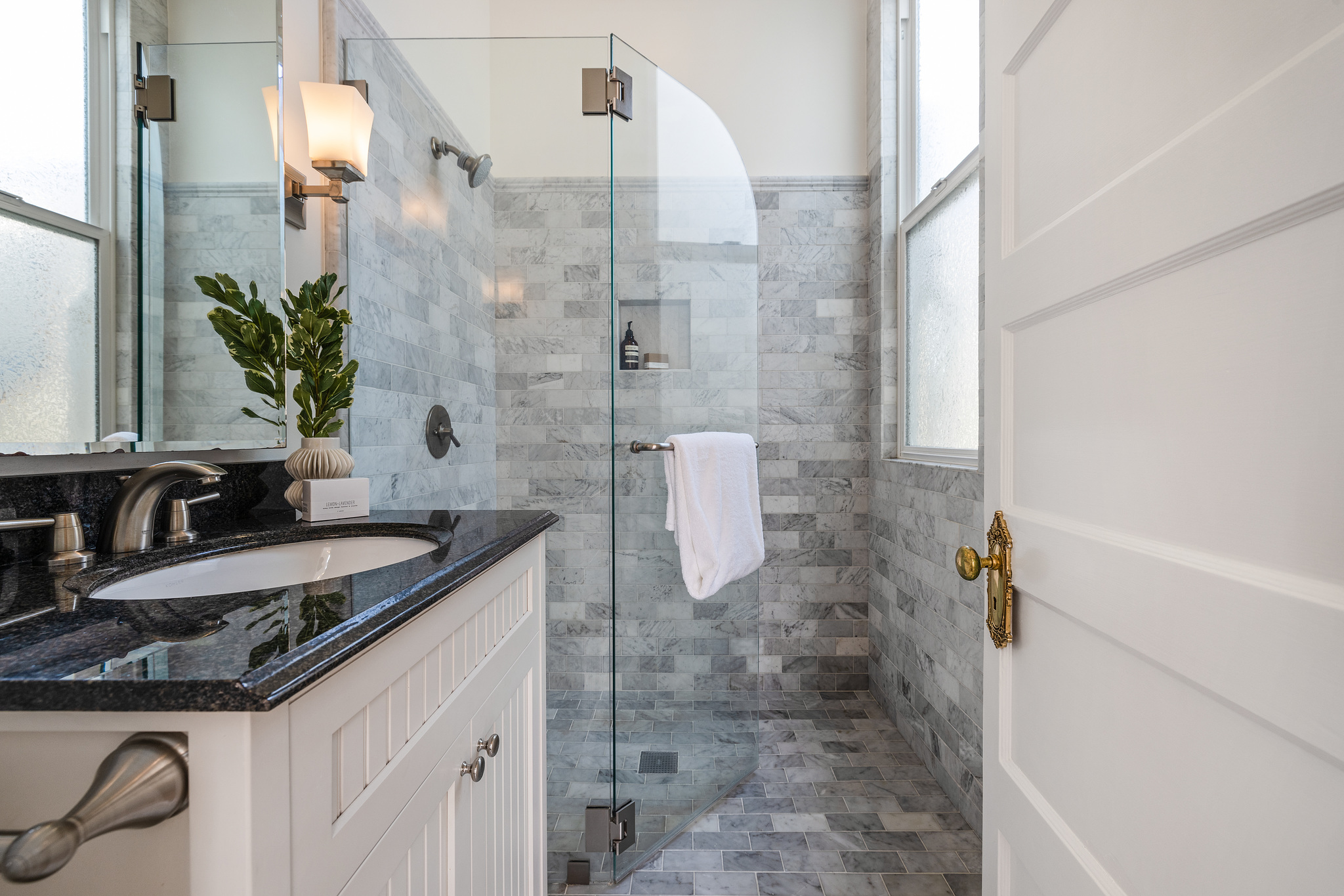 Bathroom, featuring a glass a glass shower with light grey tile