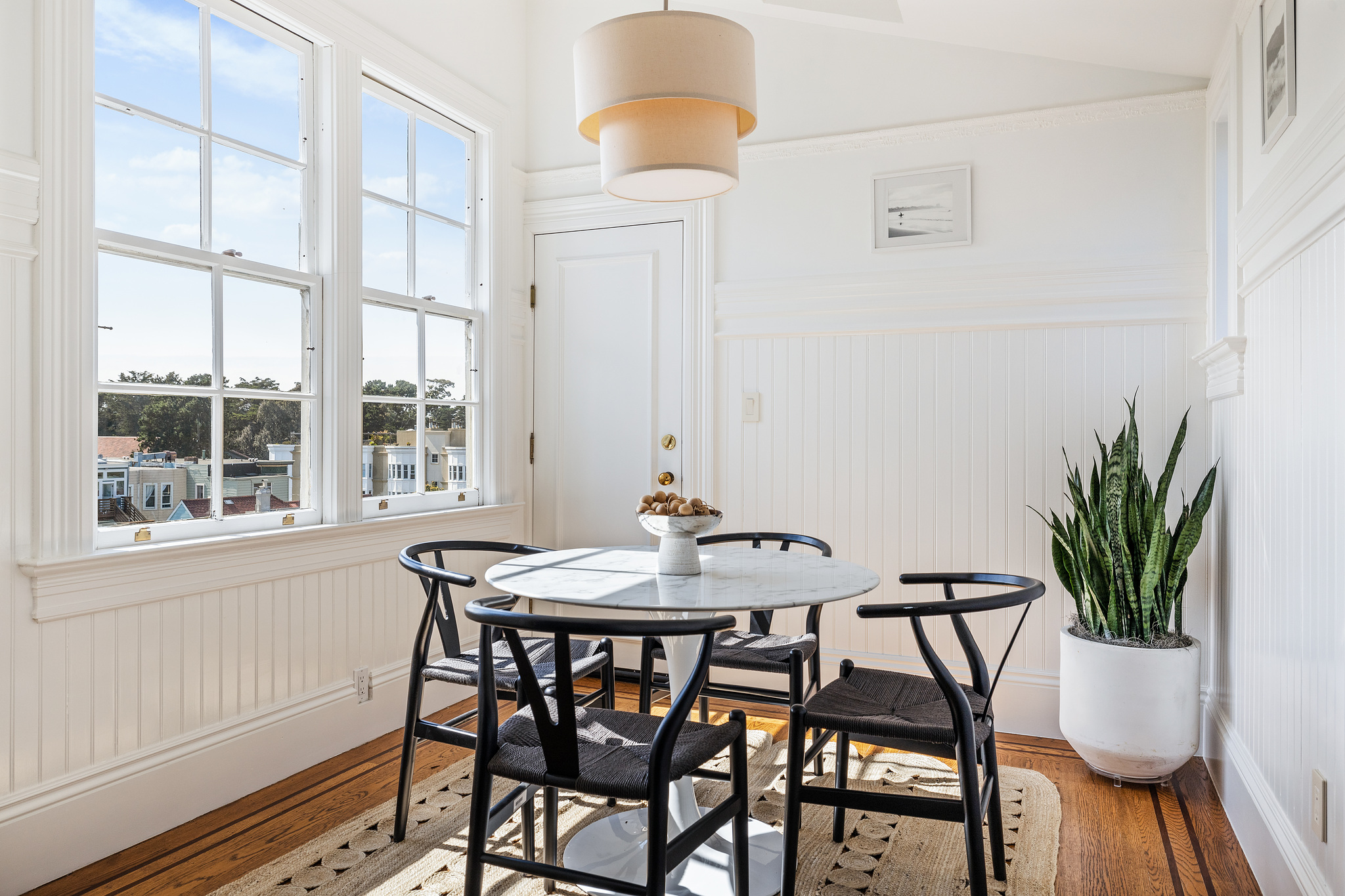 Eat-in dining area, showing light streaming in two large windows