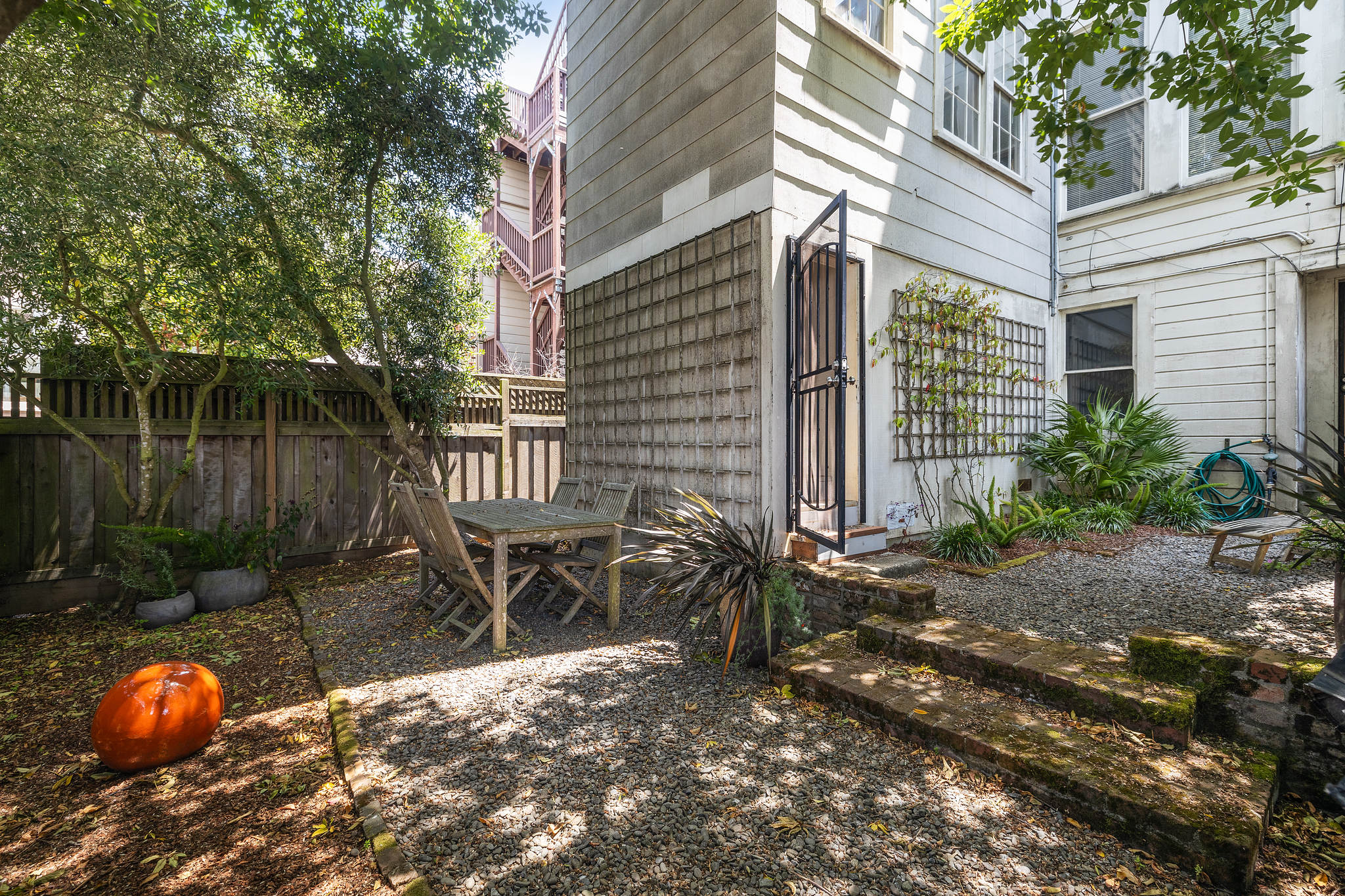Outdoor space, featuring an out-door dining area
